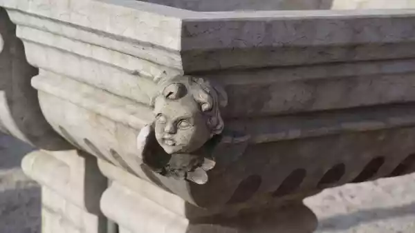 Fontana a muro in pietra con angeli